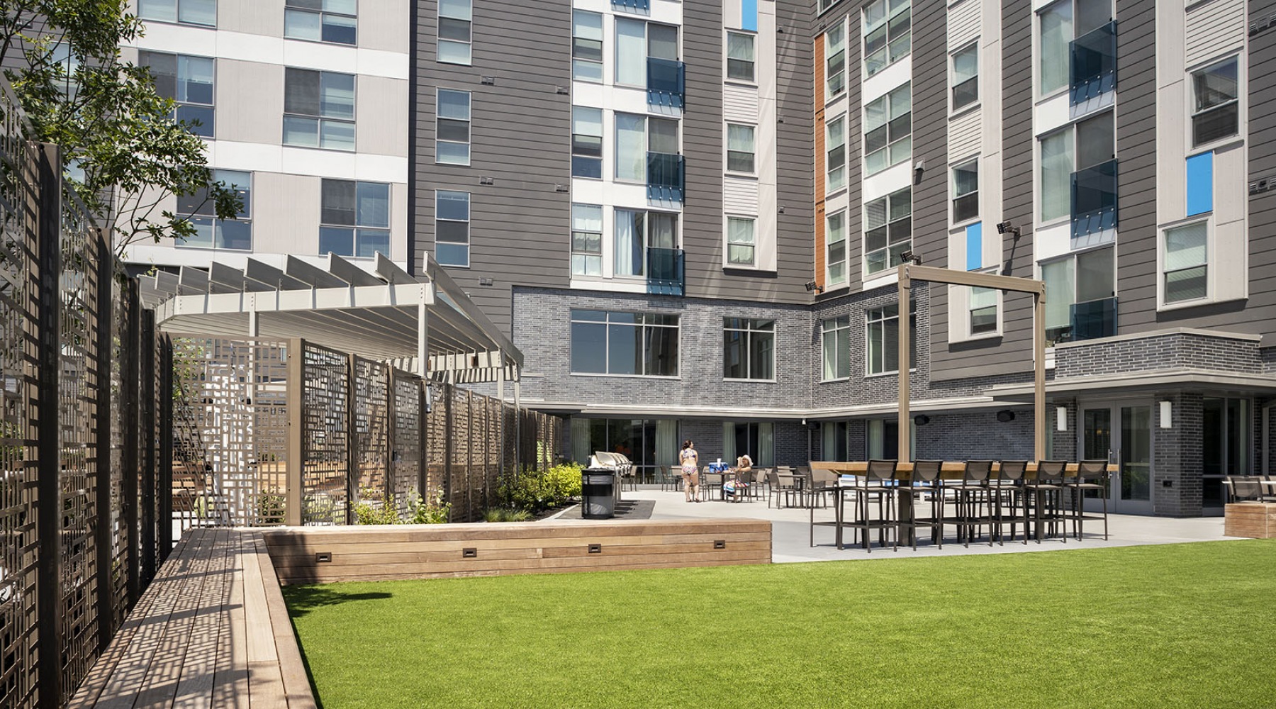 Courtyard with grassy area and seating 