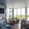 Large lounge with bar seating and a firplace